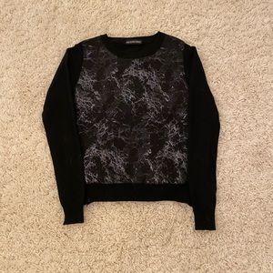 Black sweater with designs on front